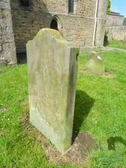 Oblique view of reverse of Thomas Williamson Headstone in churchard of St Mary, Gainford May 2016